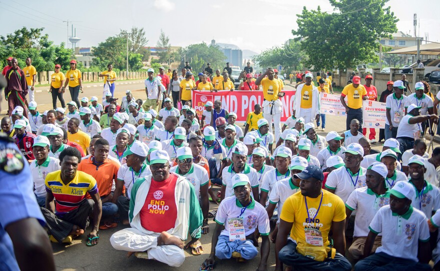 Sani Muntari, front row in yellow shirt, didn't let polio stop him. He's a teacher, a father and a soccer player.