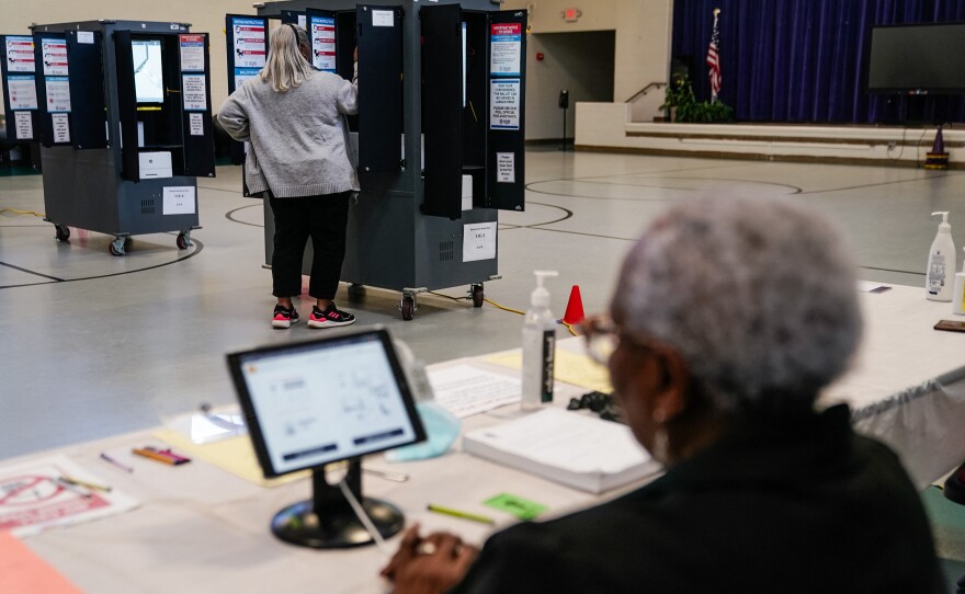 A voter casts a primary ballot at a polling place in Atlanta on March 12.