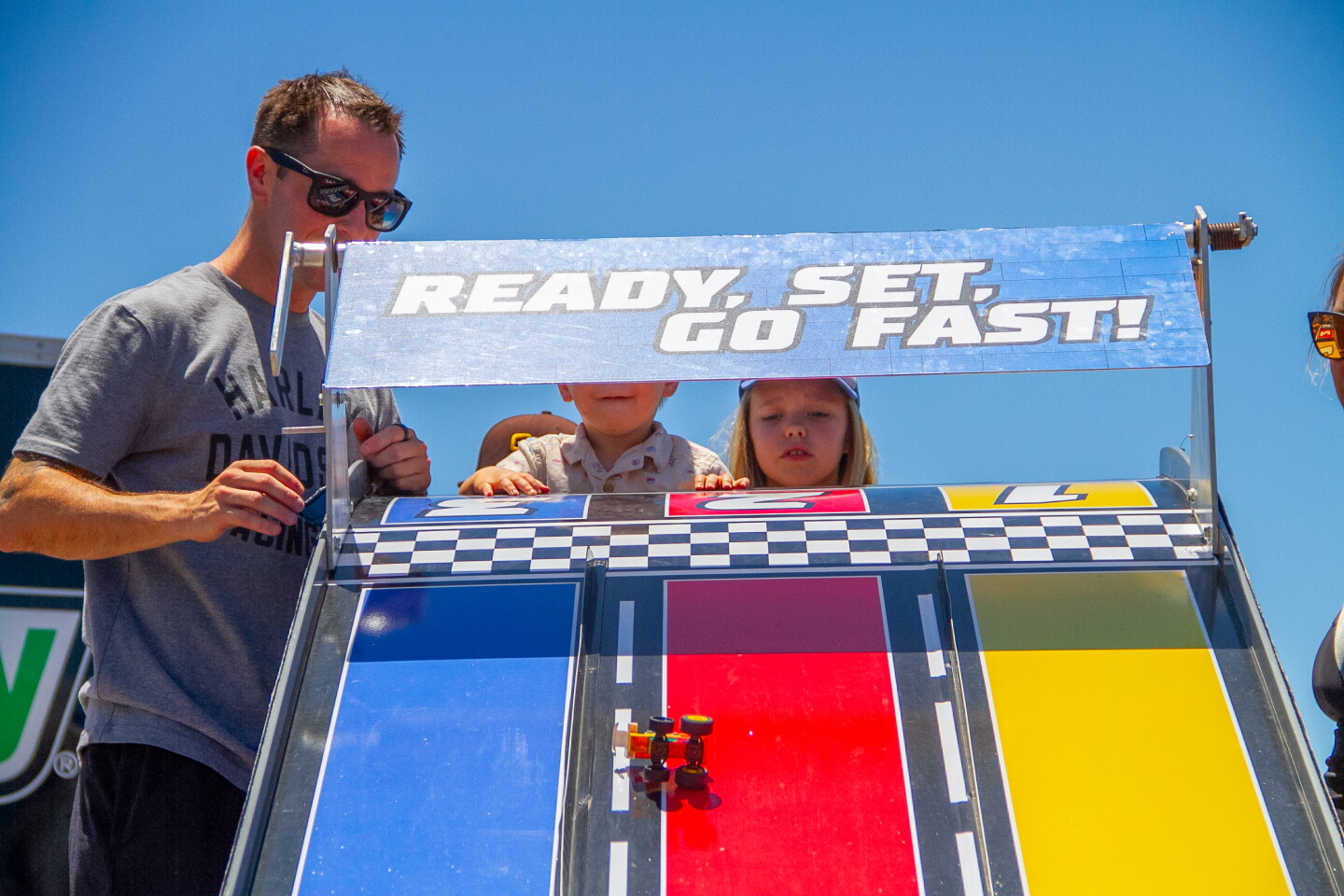 Family plays games at NASCAR San Diego Weekend presented by Anduril at Naval Base Coronado on June 19, 2026.