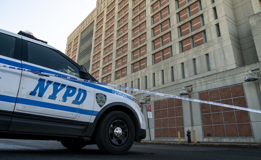 An NYPD vehicle sits outside the Metropolitan Detention Center in Brooklyn on Monday. Inmates inside suffered days of bitter cold without heat in the facility.