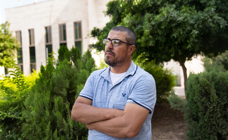 Basel Zrain, a worker from northern Gaza, has been separated from his wife and children for about a month.