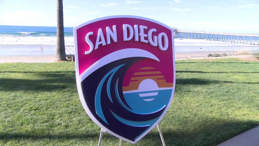 San Diego Wave FC displays their vibrant crest and colors at a news conference at the Scripps Seaside Forum on Dec. 15, 2021.