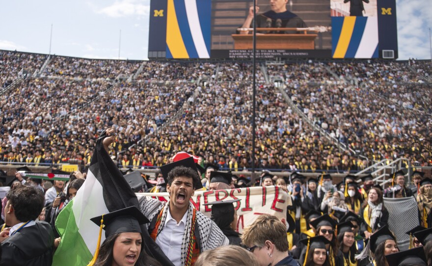 Graduates chant in support of Palestinians during the University of Michigan's commencement ceremony at Michigan Stadium in Ann Arbor on Saturday.