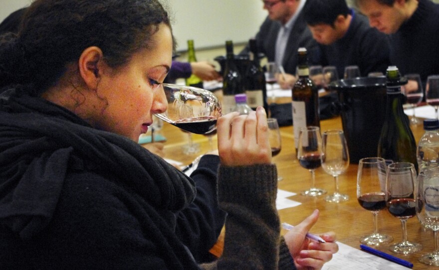 An Oxford student practices for the upcoming wine-tasting match with the University of Cambridge.