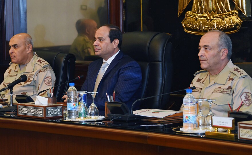 Egypt's President Abdel-Fatah el-Sissi (center) chairs a meeting of the Supreme Council of the Armed Forces in Cairo last November. As head of the military, Sissi was behind the coup that toppled Egypt's elected government in 2013.