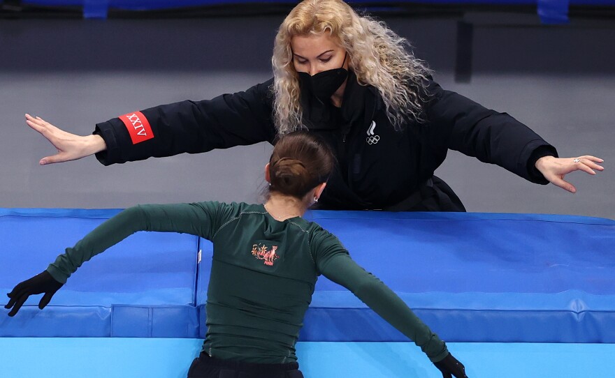 Kamila Valieva of Team ROC pictured with her coach, Eteri Tutberidze during a training session at the Beijing Olympics on February 13, 2022.
