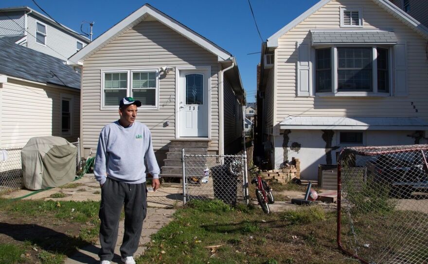 Stephen Drimalas stands outside his former home in Staten Island's Ocean Breeze neighborhood. He rebuilt his home after Hurricane Sandy but recently decided to sell it to the state.