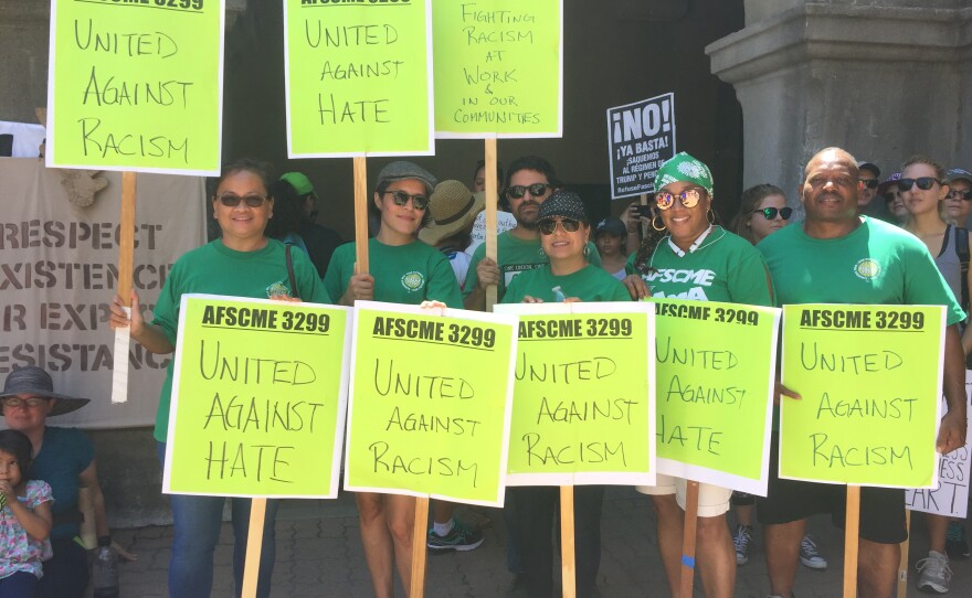 Supporters of the AFSCME Local 3299 gather for a photo at the Museum of Man in Balboa Park during the March Against Hate, Aug. 27, 2017.