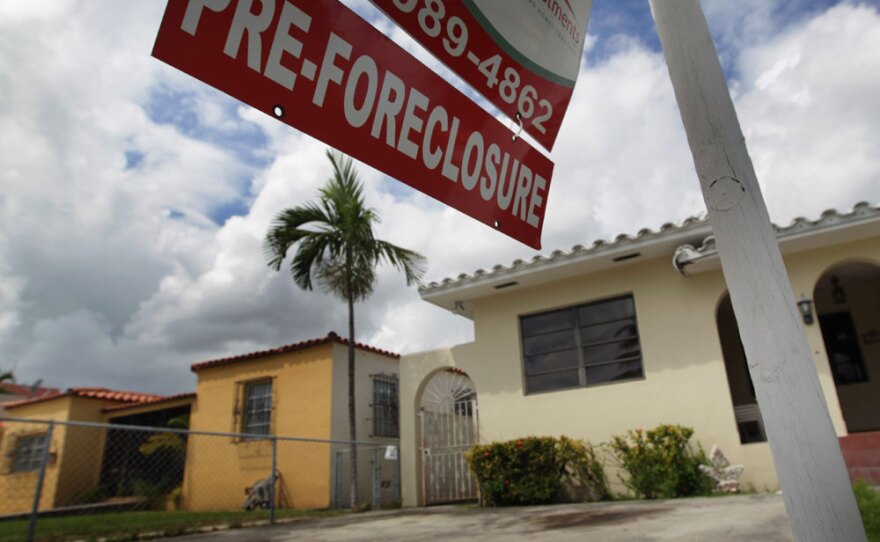 Some economists want the government to automatically refinance homeowners to prevent further foreclosures.