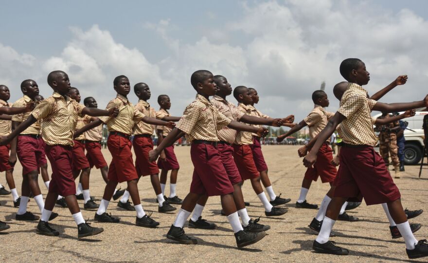 Students march during the celebration of Ghana's 60 years of independence on March 6 in Accra.