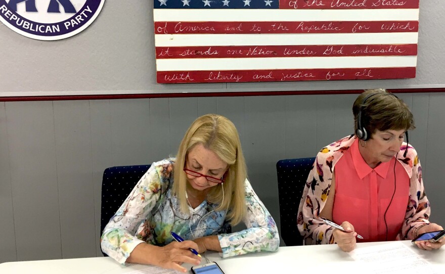 Volunteers make calls for Donald Trump at the Arizona Republican Party headquarters in Phoenix.