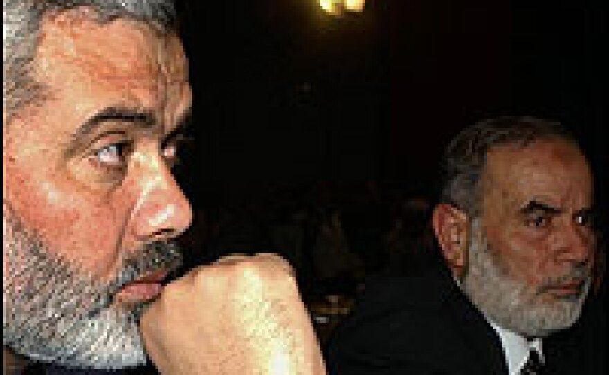 Hamas leaders Ismail Haniyeh, left, and Ahmed Bahar join the parliamentary session in Ramallah by video conference from Gaza City.