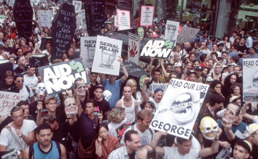 Demonstrators for AIDS research funds marched up New York's Madison Avenue on July 24, 1990, to protest President George Bush's policies on the disease.