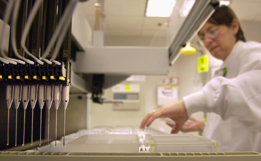 A technician loads patient samples into a machine for testing at Myriad Genetics in Salt Lake City in 2002. The Supreme Court ruled Thursday that Myriad cannot patent the BRCA genes, which are tested to check a woman's risk for breast and ovarian cancer.