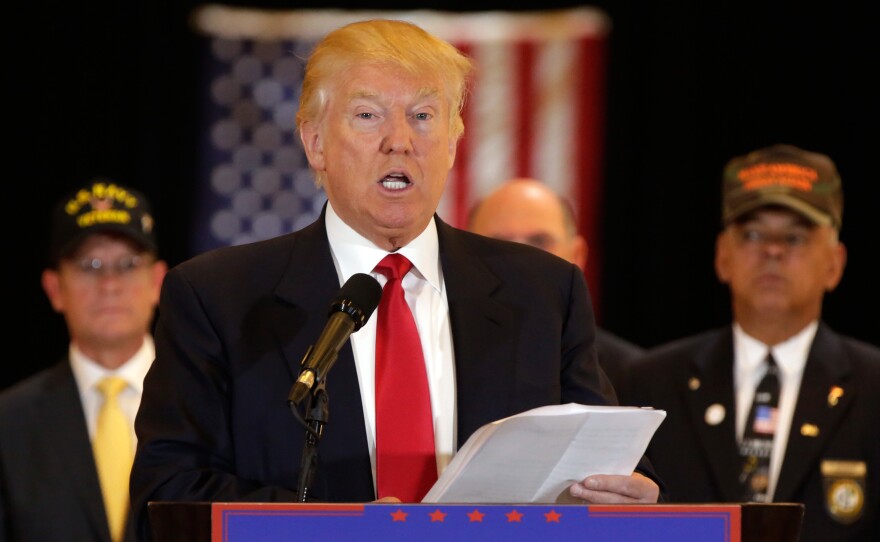 Donald Trump reads a list of donations he says were made to veterans groups following a fundraiser he held in Iowa back in January.