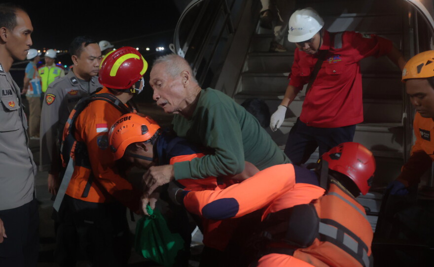 Rescuers assist a survivors of a ferry fire upon arrival at Tanjung Perak Port in Surabaya, East Java, Indonesia, Monday, Aug. 3, 2026.