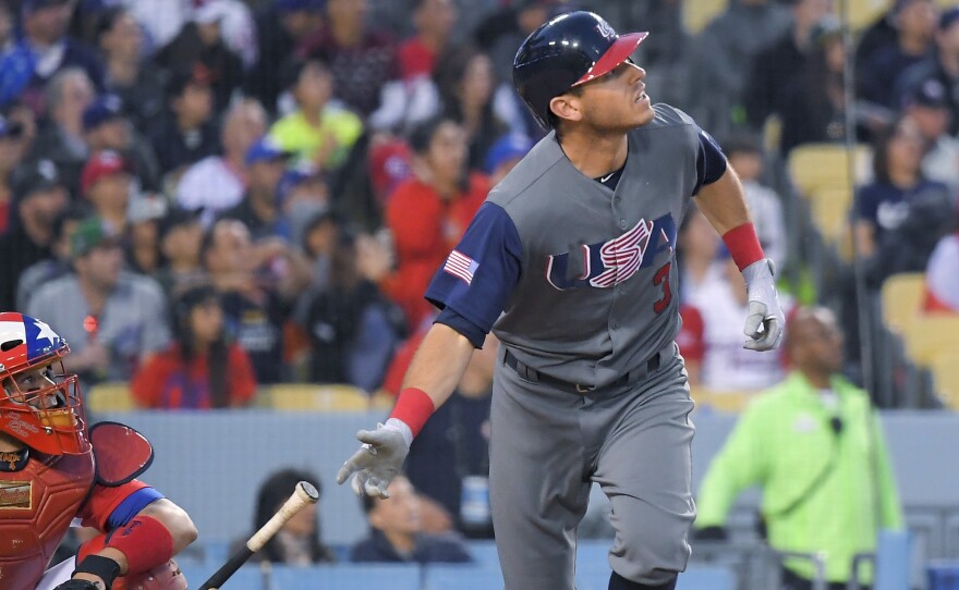 United States' Ian Kinsler watches his two-run home run against Puerto Rico on Wednesday during the third inning of the final of the World Baseball Classic in Los Angeles.