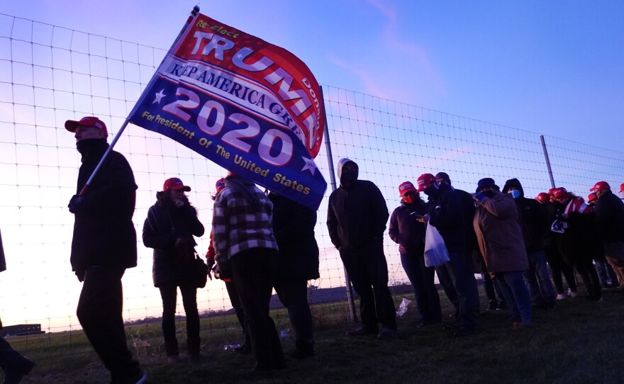 Supporters of President Donald Trump arrive for a campaign rally in Kenosha, Wis., the day before the 2020 election, which he and his supporters falsely claim he won.