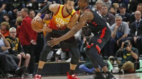 Toronto Raptors center Serge Ibaka (9) guards against Utah Jazz center Rudy Gobert (27) in the first half during an NBA basketball game Monday, March 9, 2020, in Salt Lake City. 