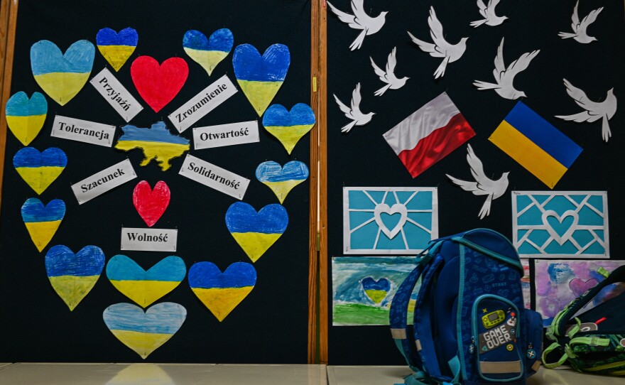 Boards with hearts and Ukrainian and Polish flags showing solidarity with children who fled the war in Ukraine are seen inside a primary school classroom in Krakow, Poland.