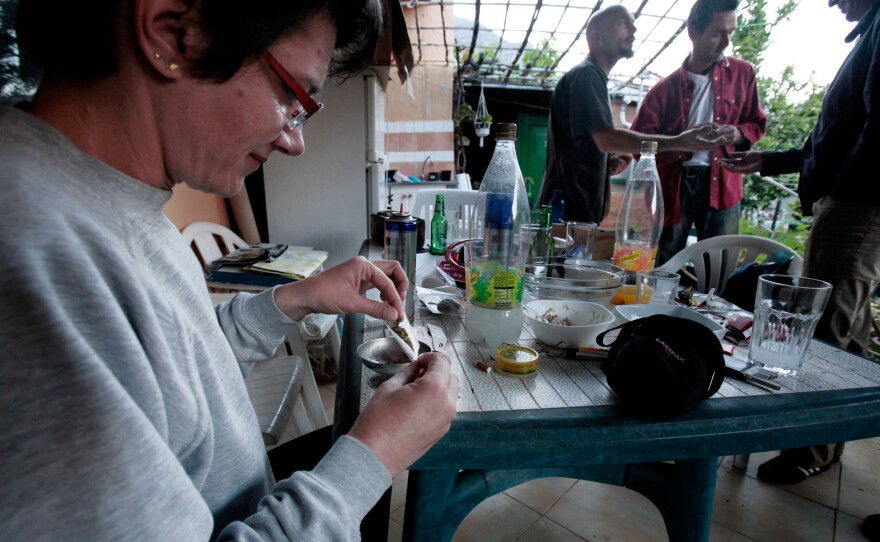Eliane Detraz, a 42-year-old Swiss national member of the Sibaratas Med Can club, rolls a joint at the plantation of the association in Spain's Canary Islands in April 2013.