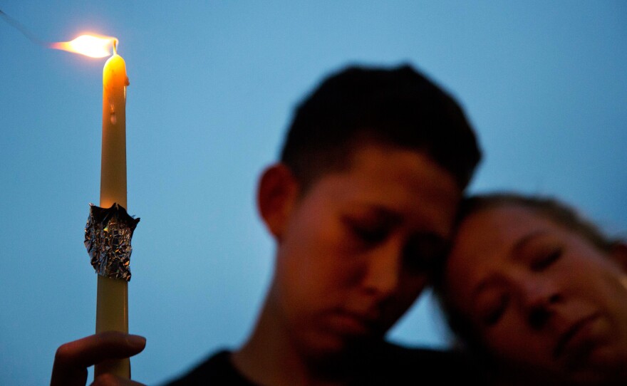 Vigils have been held around the country for the victims of the Orlando nightclub attack on June 12. Thousands of people, including Jennifer Ware (right) and Mary Ware, took part in a memorial in downtown Orlando a day after the massacre.