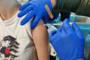 A patient receives a bivalent Pfizer COVID-19 vaccine at Kaiser Permanente Otay Mesa Medical Offices. Nov. 4, 2022.