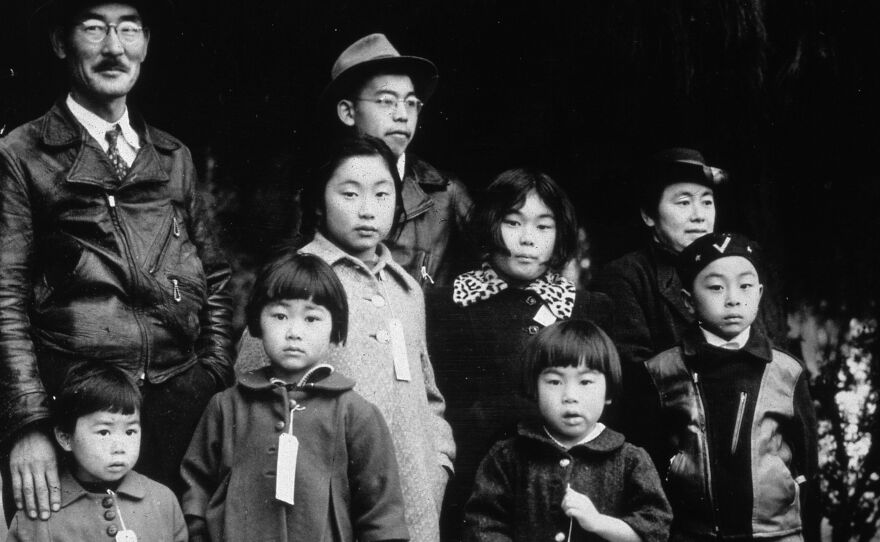 Members of the Japanese-American Mochida family await relocation to a camp in Hayward, Calif.