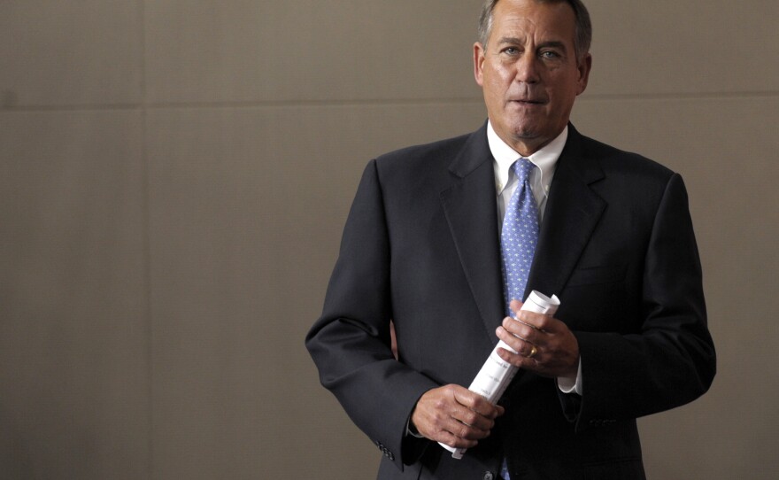 House Speaker John Boehner arrives for a news conference on Capitol Hill on Friday.