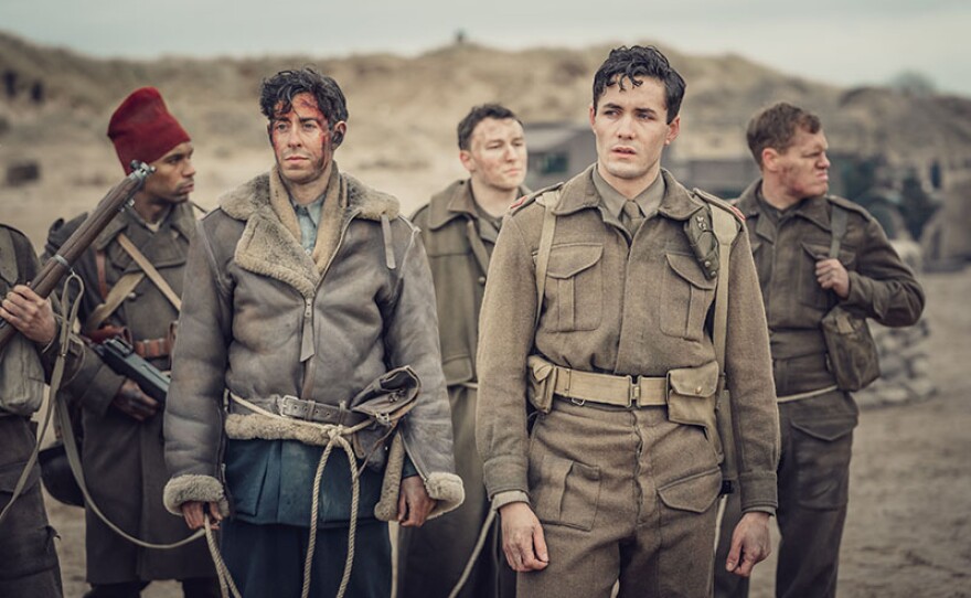 Shown from left to right: Matthew Romain (as Geoff) and Jonah Hauer-King (as Harry Chase)