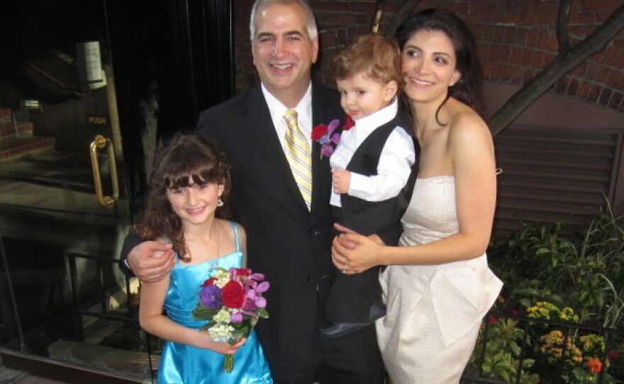Shadid stands with wife Nada, son Malik and daughter Laila at his brother's wedding last summer.