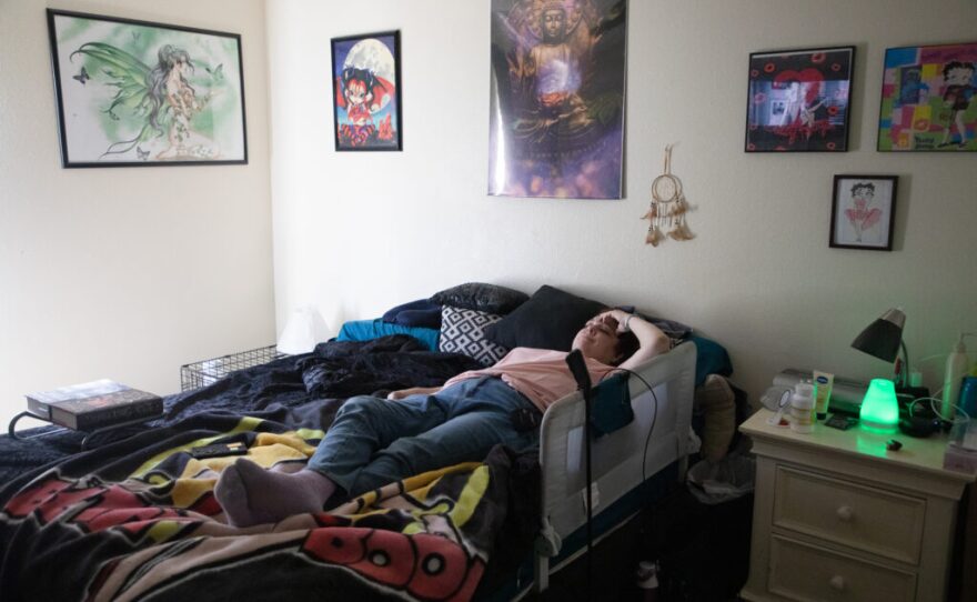 Army veteran AJ Williams watches a movie from her bed in El Cajon, May 27, 2020. Since switching to Spravato ketamine treatments she has found herself retreating into more self isolation in her room.