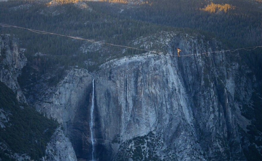 Moises Monterrubio walks the line. Highlining is different from walking a tightrope, with the line dipping down significantly.