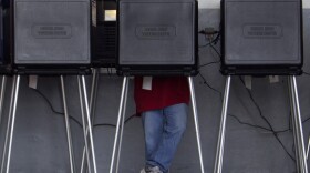 A voter casts his ballot in a West Miami, Fla., fire station during the Republican primary in January.