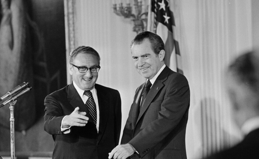 U.S. Secretary of State Henry Kissinger, left, and President Richard M. Nixon are shown after Kissinger was sworn in in the East Room of the White House on Sept. 22, 1973.