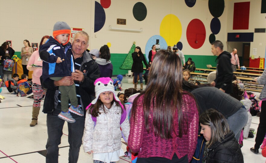 Parents pick up their kids from Garfield Early Childhood Center, a pre-K facility serving all children in the district. Burmese, Mandarin, Arabic, and many Spanish dialects are among at least 27 languages spoken at home by children in the district.