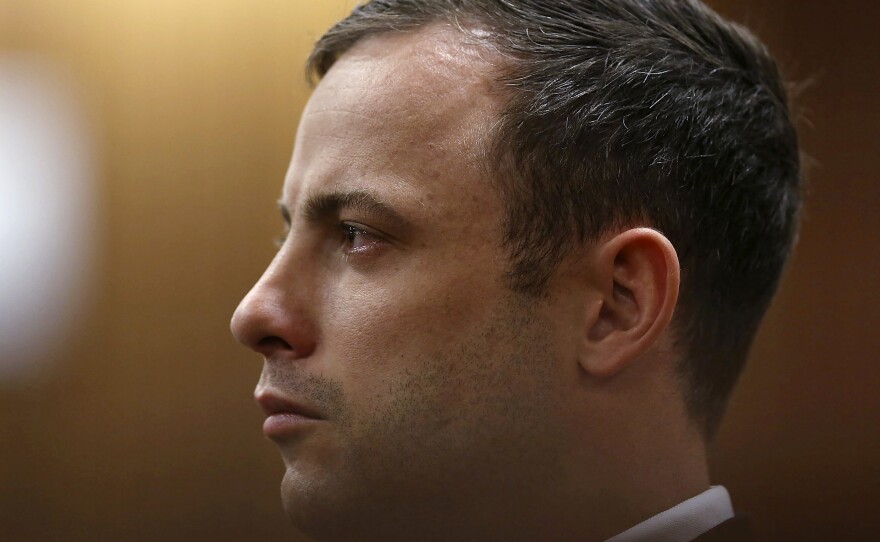 Olympic and Paralympic track star Oscar Pistorius listens to Judge Thokozile Masipa (unseen) deliver her verdict at the North Gauteng High Court in Pretoria on Friday.