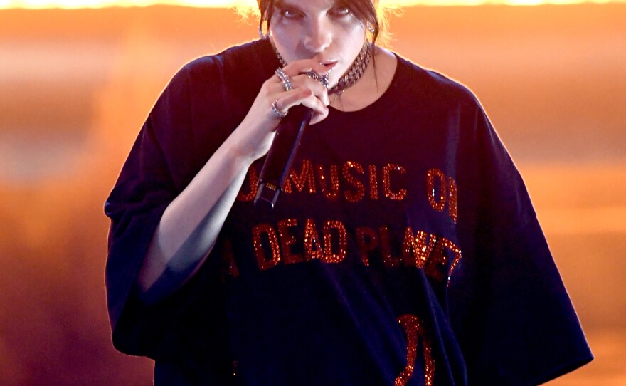 Billie Eilish performs at the American Music Awards in November. Eilish's music speaks for weird kids in the same way most of teen pop has spoken for idealized "normal" ones.