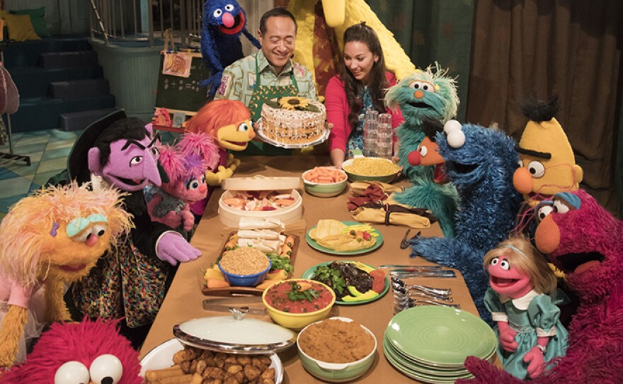 SESAME STREET Season 49 cast at holiday table.