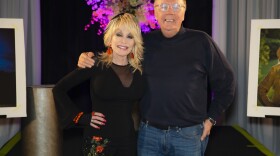 Dolly Parton and James Patterson pose for a picture in August 2021. Their new novel, <em>Run, Rose, Run</em>, is about an aspiring country singer in Nashville.