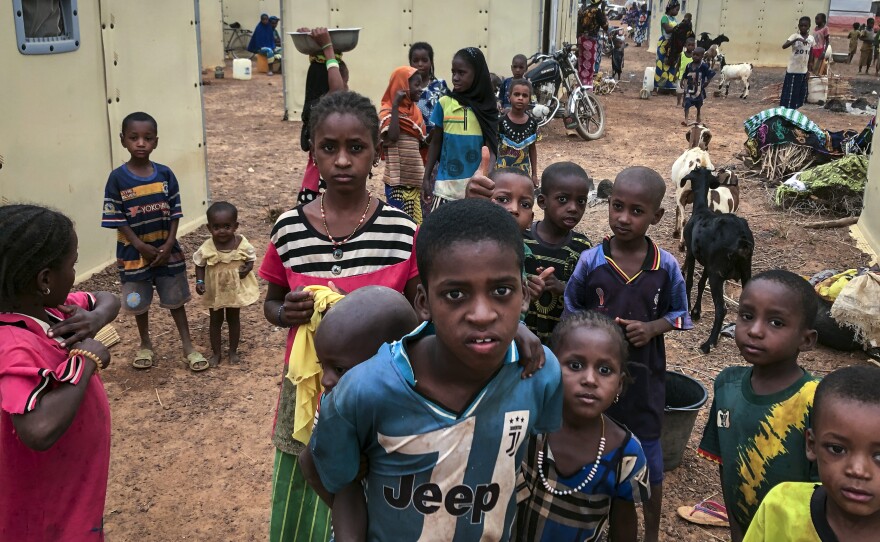 Children of around 6,000 ethnic Fulanis who have been displaced by attacks, gather in a makeshift camp for the displaced in Youba, Burkina Faso, in April 2020. The West African nation continues to be wracked by violence linked to Islamic extremists and local defense militias.