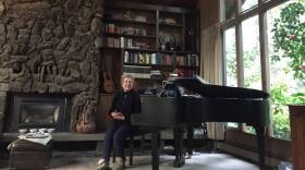 Arlene Harms pictured at the baby grand piano in what used to be her home in Paradise in this undated photo. 