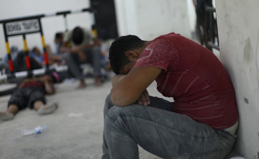 Survivors of a capsized migrant boat at a police station in Rosetta, Egypt, on Wednesday. More than 100 people have been confirmed dead, and hundreds more are unaccounted for.