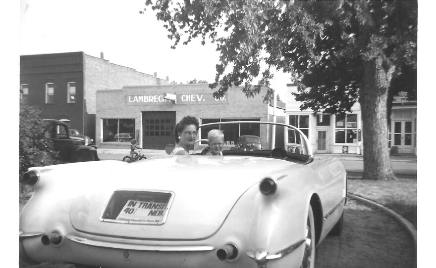 A family photo provided by Jeannie Stillwell, daughter of car dealership owner Ray Lambrecht, shows Mildred Lambrecht, Ray's wife, and their son Mark in a brand new 1953 Corvette, in front of the dealership.
