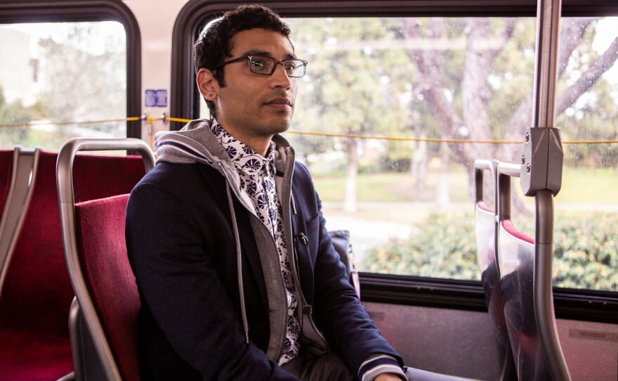 Mass transit advocate Matthew Vasilakis, on his way home from his job in University Heights, rides the Mid-City Rapid 215 bus on March 4, 2019.