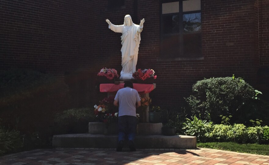Retired truck driver Frank Rivera, 63, prays at the grotto of the Sacred Heart in the courtyard of St. Alexis Catholic Church, Bensenville, Ill. About half of Bensenville's residents are Latino, many of whom were born here or came to the U.S. decades ago and are U.S. citizens.