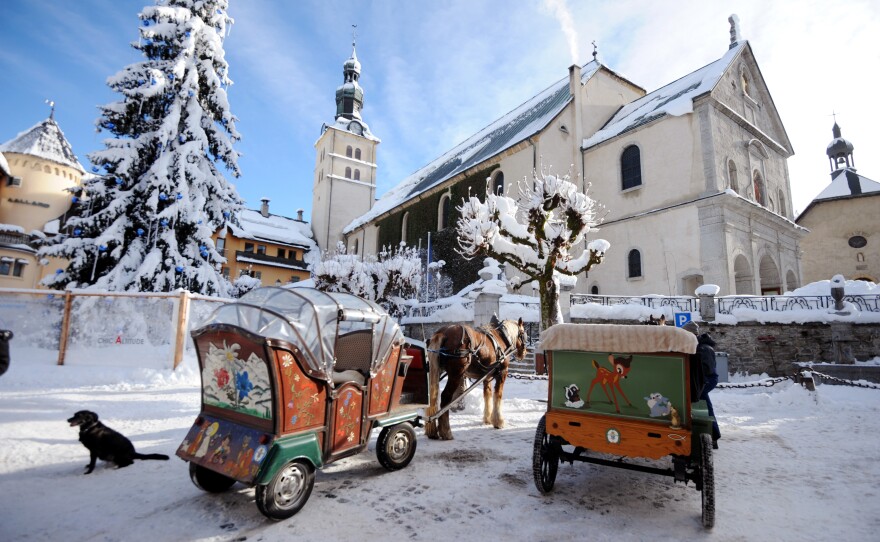 Horse-drawn carriages wait for clients on Dec. 19, 2012, in Megeve.