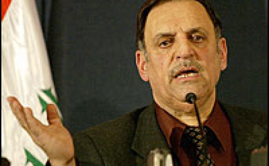 Safwat Rashid of Iraq's electoral commission announces election results.