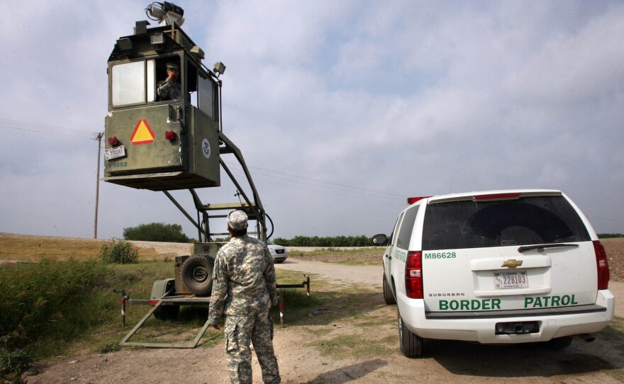 A member of the National Guard checks on his colleague inside a Border Patrol Skybox near the U.S.-Mexico border in Hidalgo, Texas, in this 2011 photo. President Trump is calling for troops on the southern border, something the last five presidents have all done.