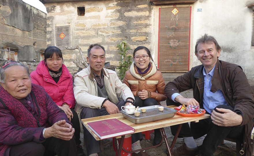 Michael Wood with Zhao family members at their fortified village, Fujian province, China. 